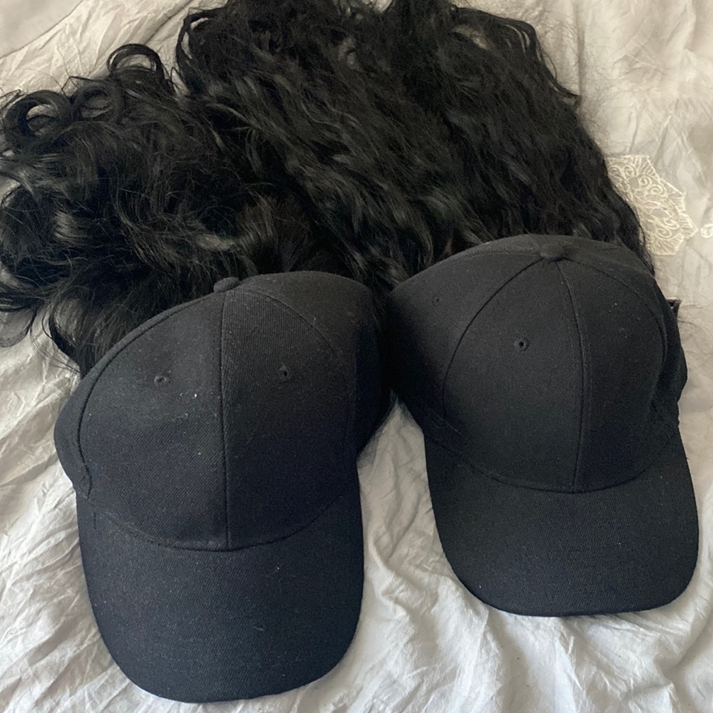 One available- NEVER WORN HATs WITH CONNECTED SYNTHETIC HAIR (WILL SEPARATE)